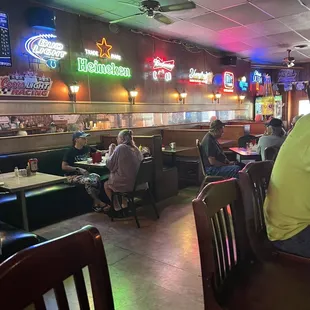 people sitting at tables in a restaurant