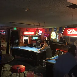 billiards, pool tables, and neon signs