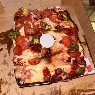 a pizza in a cardboard box