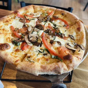 Margherita pizza, added mushrooms. FYI it doesn&apos;t come with red sauce, but EVOO with lots of garlic :)