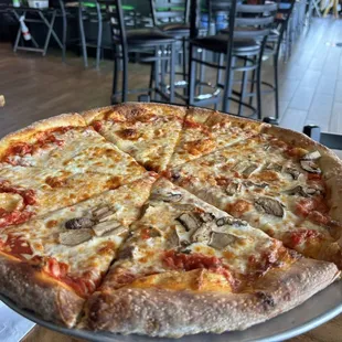 Half cheese and mushroom pizza
