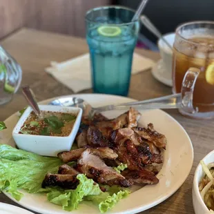 BBQ Pork - Marinated pork loin with garlic and lemongrass herbs. Served with tangy dipping sauce.