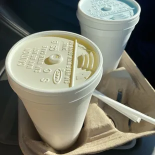 two cups of drink on a tray