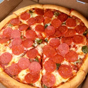a pepperoni pizza in a box