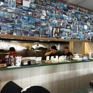 Hard working staff in motion :) Taking care of the customers and knocking out the orders. Great food, great atmosphere, great service!