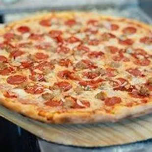 a pepperoni pizza on a cutting board