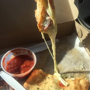 Pepperoni Calzone with bell peppers, pepperoni, and hot peppers.