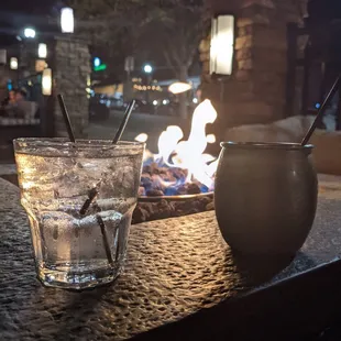 a drink and a fire pit