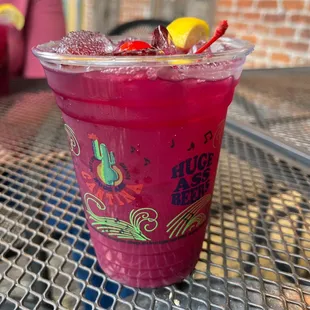 a cup of fruity drink on a table