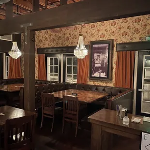 a dining area with tables and chairs