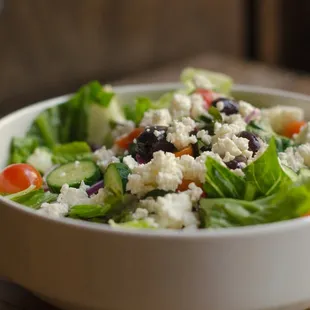 a bowl of salad on a table