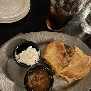 Carne Adobada.  Served with sour cream and salsa.  Crust is delicious.