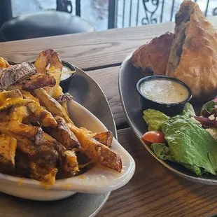 oggie, side greek salad, oven chips w/ cheese