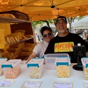 Robert Medez and his wife offering DE-licious gourmet popcorn!