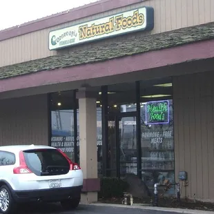 car parked in front of store