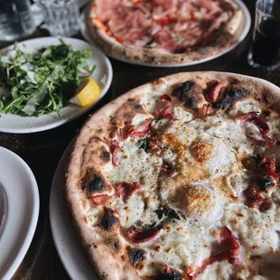 Insalata di parma and pizzas from Cornuto Pizzeria in Greenwood.