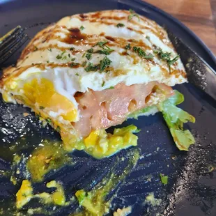 Avocado toast with egg, tomato, arugula. After I dug in.