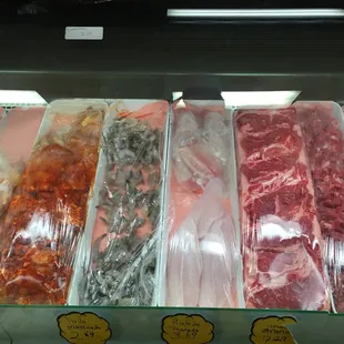 a display of meat in plastic bags