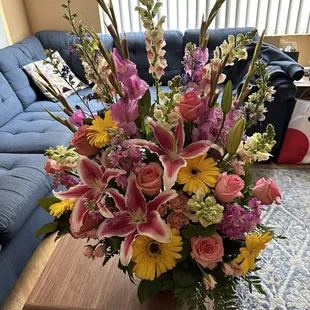 Beautiful, bright arrangement delivered to our home (due to a mix up and not getting delivered for the funeral yesterday).
