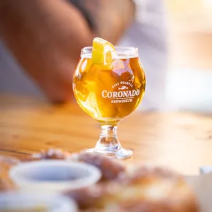 a glass of beer and donuts