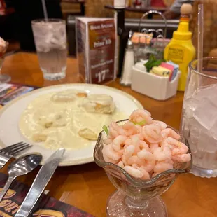 Bay shrimp, shredded lettuce, and cocktail sauce with two buttermilk biscuit and country gravy.