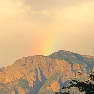 Rainbow or rainbar over mountains