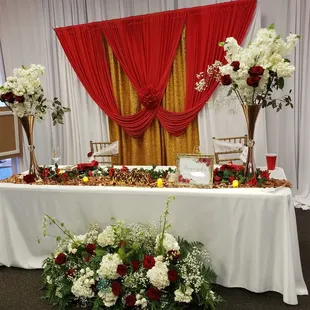 a table decorated with flowers and candles