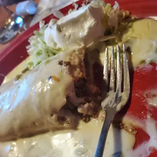 Enchilada with queso instead of red or green sauce