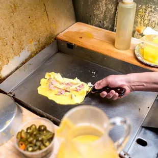 a person making an omelette