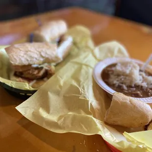 two sandwiches and a bowl of chili