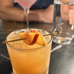 Peach cocktail, beatnik bohemian in the background