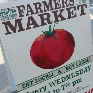 a sign for the farmers market