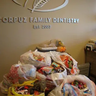 Every year, we buy back Halloween candy for $1 a pound (up to 5lbs.) and then we donate it.  It's a win-win!