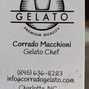 a hand holding a business card