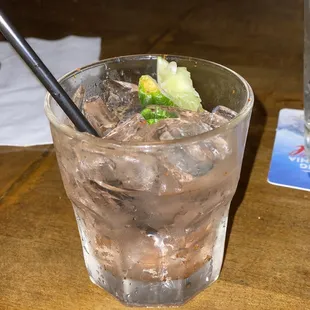 a drink with ice and lime