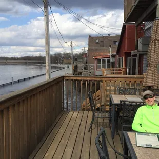 The water is so high we can see the river under our feet on the patio. Notice the one-way sign on the road.