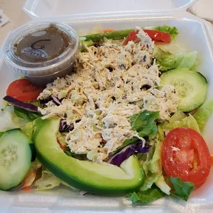 a salad in a styrofoam container