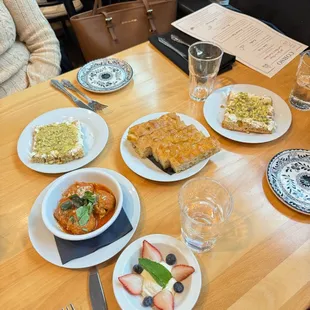 Clockwise from left: honey toast, foccacia for the table, more honey toast, berry bowl, meatballs
