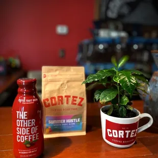 a coffee bag and a plant