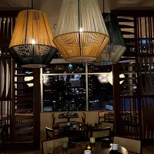 a dining room with a view of the city