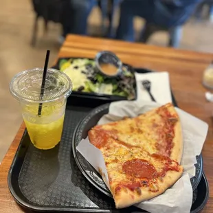 a slice of pizza and a salad
