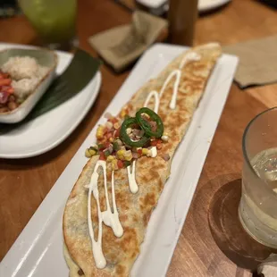 Machete Quesadilla - cumin-dusted mushrooms, Oaxacan cheesec jalapeño-corn relish, lime ($16)