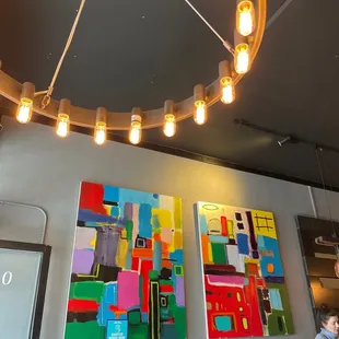 a circular chandelier with hanging lights