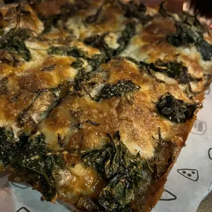 San Danielle Sicilian pizza with three cheeses, mushroom, spinach and garlic