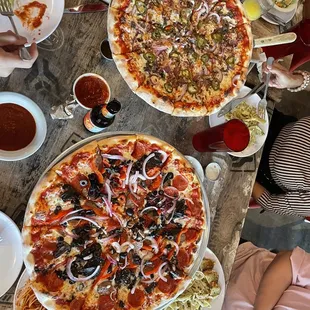 two pizzas on a table