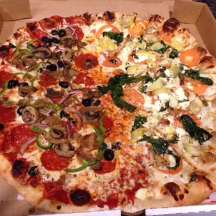 Half nostra supreme half Greek pizza. Both really good but preferred the Greek chicken half