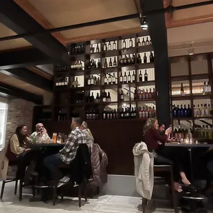 a group of people sitting at a bar