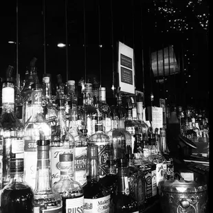 a black and white photo of a bar