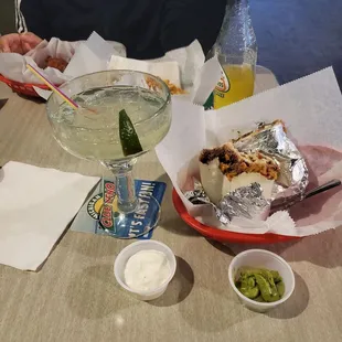 Shredded beef burrito with margarita on the rocks