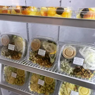 a display of fresh fruit and desserts